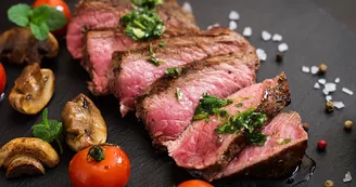 Juicy steak medium rare beef with spices and grilled vegetables. Juicy steak medium rare beef with spices and grilled vegetables.